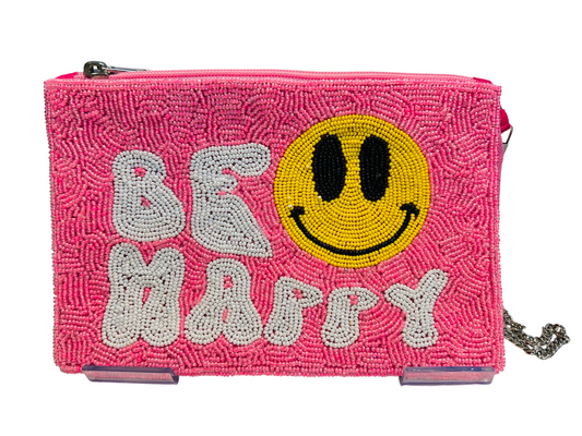 The BE HAPPY Pink Floral Handmade Seed Bead Crossbody Bag features white bead lettering, a large yellow smiley face, a top zipper, and a 46" detachable silver chain strap.