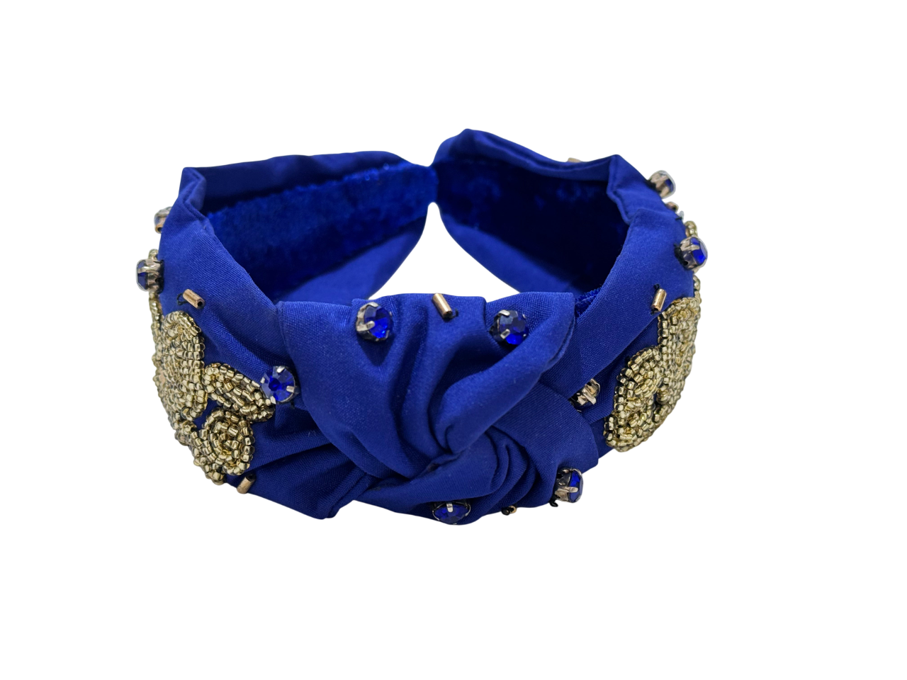 The Royal Blue Knot Headband with Gold Paw Embellishments features gold beaded floral appliqués, a central knot, delicate gold paw for animal lovers, and blue gemstone accents, shown on a white background.