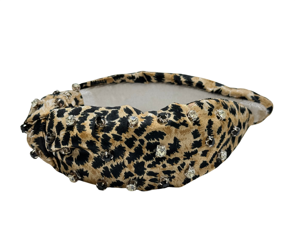 The Handcrafted Stylish Leopard and Cheetah Print Beaded Headband features a padded, ruched design with clear rhinestones and a wide structured shape, adding a bold accent to any outfit.