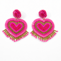 Handmade Pink Beaded Earrings for Valentine's Day—these romantic, heart-shaped dangle earrings feature pink sequins, beads, gold accents, and playful beaded fringe, perfect as a thoughtful gift.